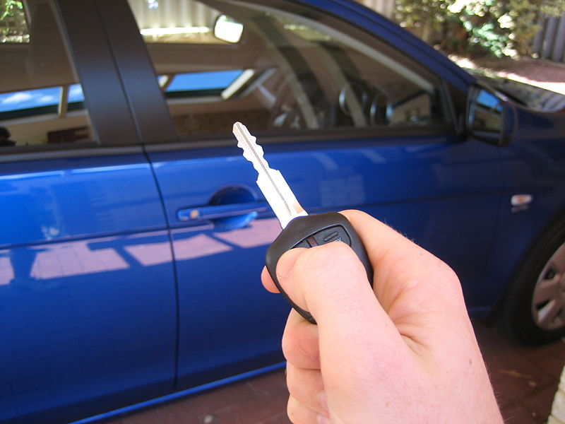 Image of hand holding car key
